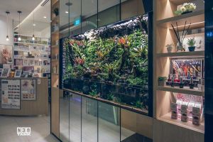 Aquarium with side shelving. Entire aquarium and cabinets are custom-made by N30 Singapore.