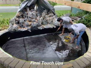 Final touch ups and restoration of the pond.