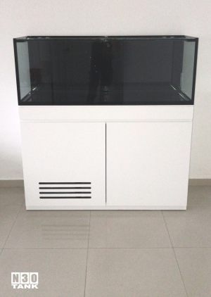 Unique-018: Low-profile cabinet tank set custom-made by N30. This 2-door aquarium cabinet sits elegantly in the room, and the dark tank is contrasted against a light-colour wall.